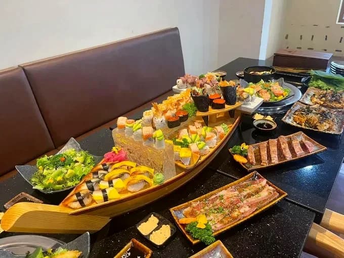 Sushi boat and Japanese dishes on a restaurant table