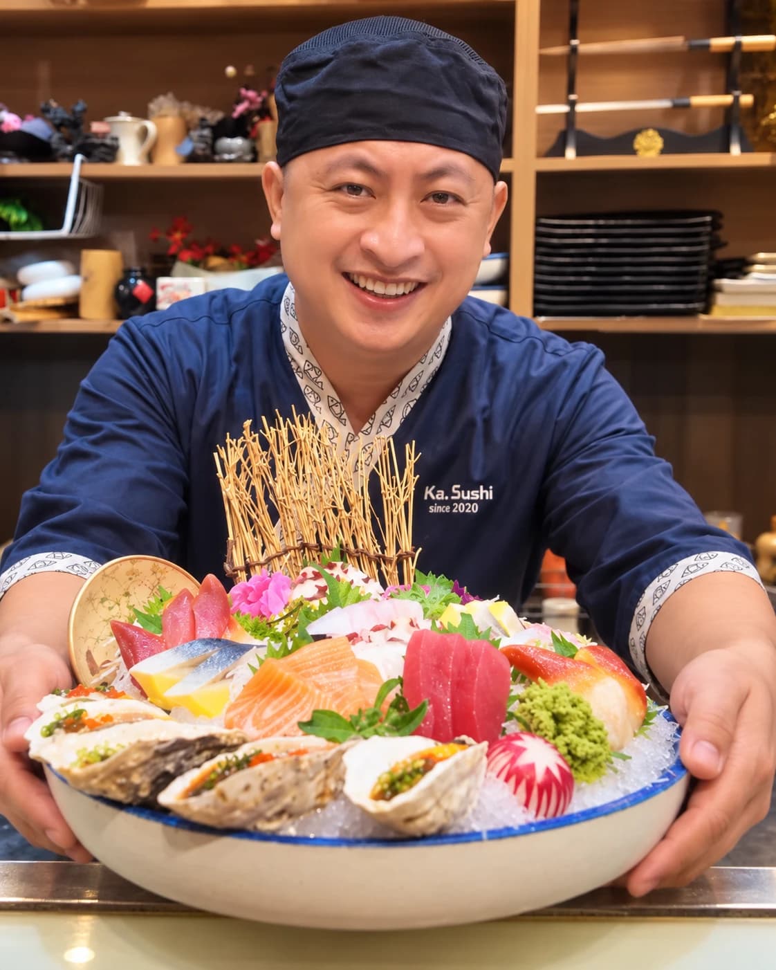 Suika Sushi chef presenting a colourful seafood platter